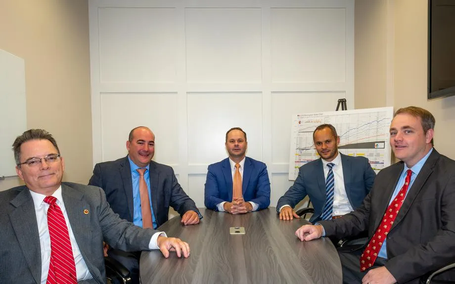 The Cape Cod Wealth Strategies & Insurance Services team seated around a conference table